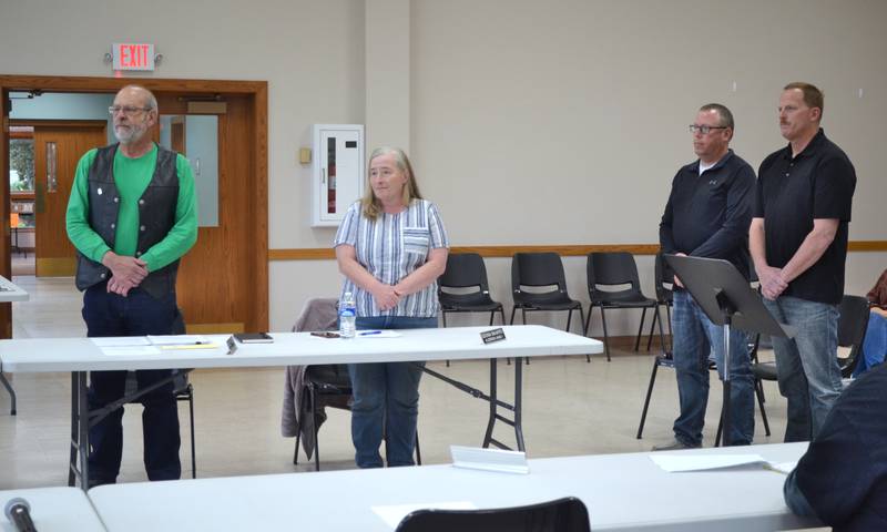 Incumbent Ward 1 Alderpersons Gregory Kruse and Sidonna Mahaffey, left, and new Alderpersons Matthew Tichler, Ward 4, and Todd Schlegel, Ward 2, take their Oath of Office at the Morrison City Council meeting on Monday, May 8. Also getting sworn in for their terms were Vernon Tervelt, Ward 3, and City Clerk Michael Hemmer.