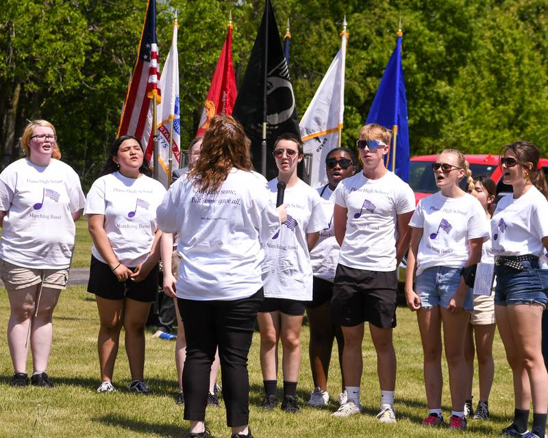 Plano High School choir sings the National Anthem during the Memorial Day remembrance held at Little Rock Township Cemetery in Plano on Monday May 29th.