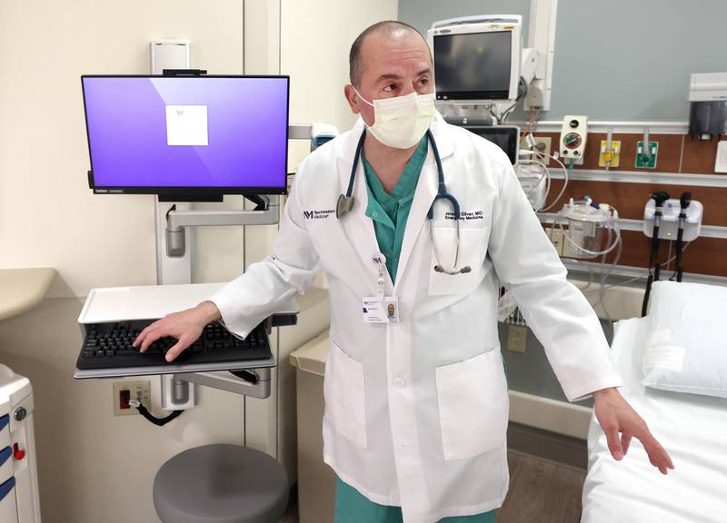 Dr. Jeremy Silver, medical director in the emergency department at Northwestern Medicine Kishwaukee Hospital, talks about state-of-the-art technology in one of the emergency room bays Monday, March 28, 2022, in the recently completed phase 2 of the three-phase renovation project in the ER at the facility.