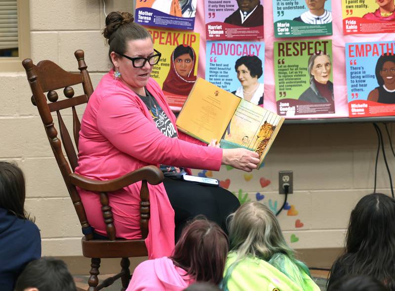 Cortland Elementary School librarian/media assistant Leslie Leahy reads a book to fourth graders Tuesday, March 31, 2026 in the library at the school.