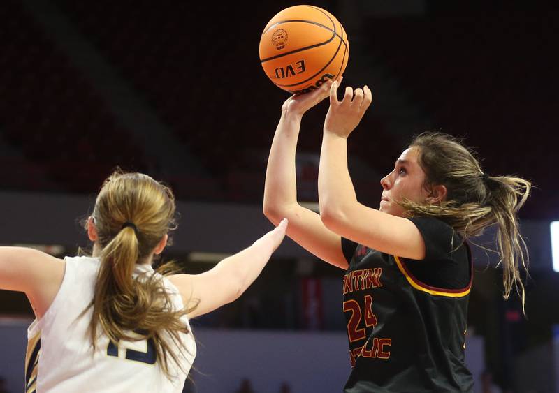 Montini's Peyton Farrell lets go of a shot over Quincy Notre Dame's Tristan Pieper during the Class 3A State semifinal game on Thursday, March 6, 2025 at CEFCU Arena in Normal.