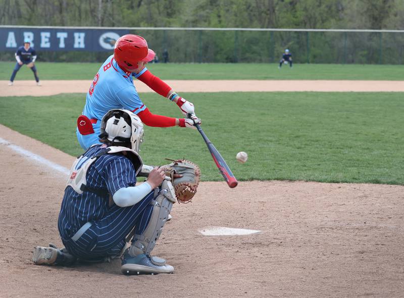 Benet's Cole Rosenthal (3) makes contact during the varsity baseball game between Benet Academy and Nazareth Academy in La Grange Park on Monday, April 24, 2023.