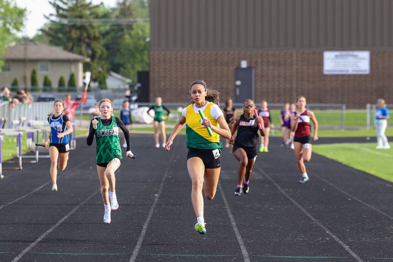 Bishop McNamara's Jaide Burse finishes in the lead during the 4x100 relay race at the Manteno Track Invite on Friday, April 24, 2026.