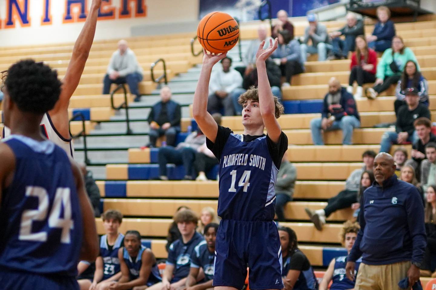 Plainfield South's Dillon Keeley (14) shoots a three pointer against Oswego during a basketball game at Oswego High School on Friday, January 17, 2025.