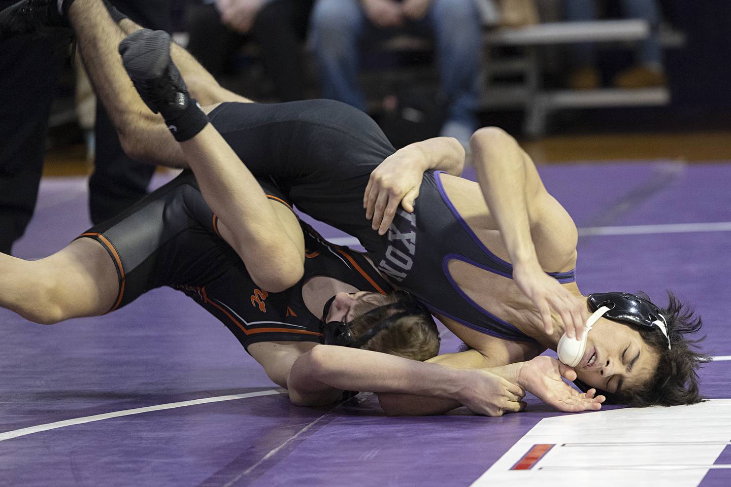 Dixon’s Riley Paredes works against Freeport’s Treyden Diduch Tuesday, Jan. 13, 2025, during a triangular meet with Sterling at Dixon High School.