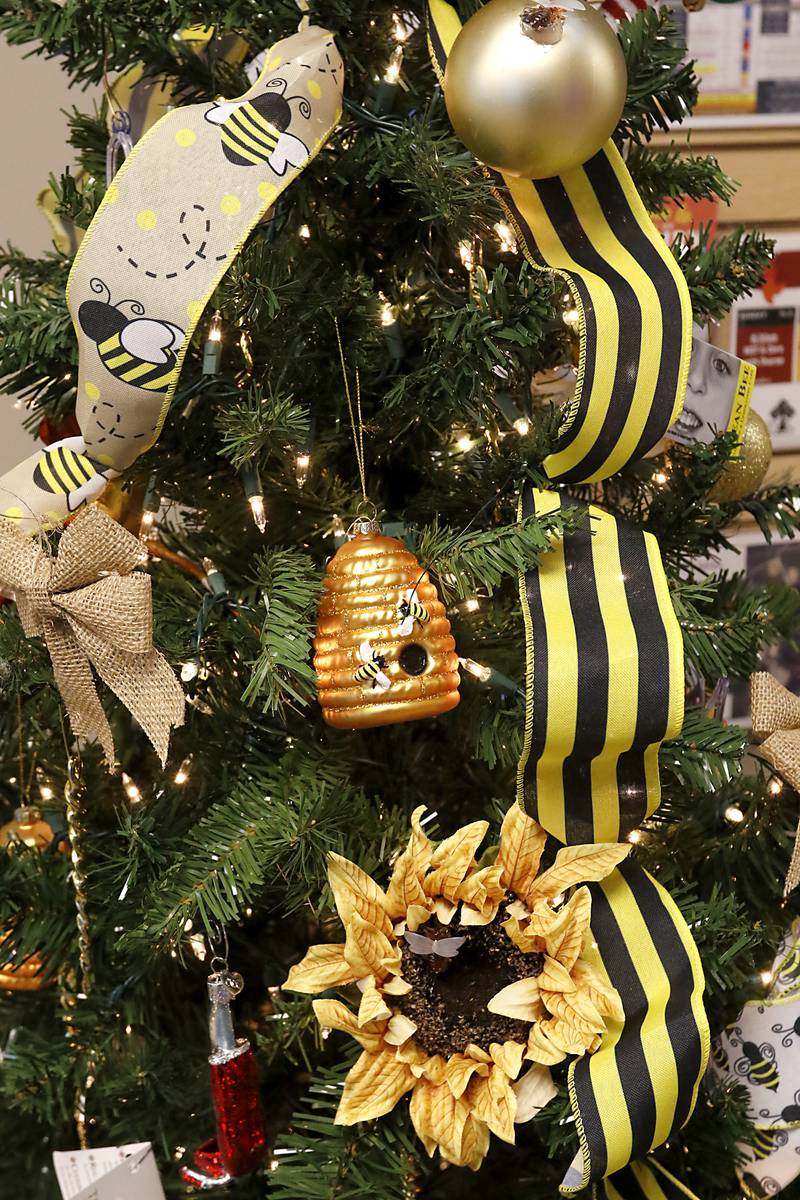 Decorations on the Clean Bee Flooring and Upholstery Care Services Christmas tree on Thursday, Nov. 21, 2024. The tree is decorated for the McHenry Chamber of Commerce Festival of Trees at the McHenry Recreation Center.