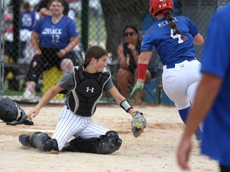 Sycos' Gianna Lovegren tries to tag a runner Friday, June 27, 2025, during their 16u game against Select Fastpitch in the Storm Days tournament at the Sycamore Community Sports Complex.
