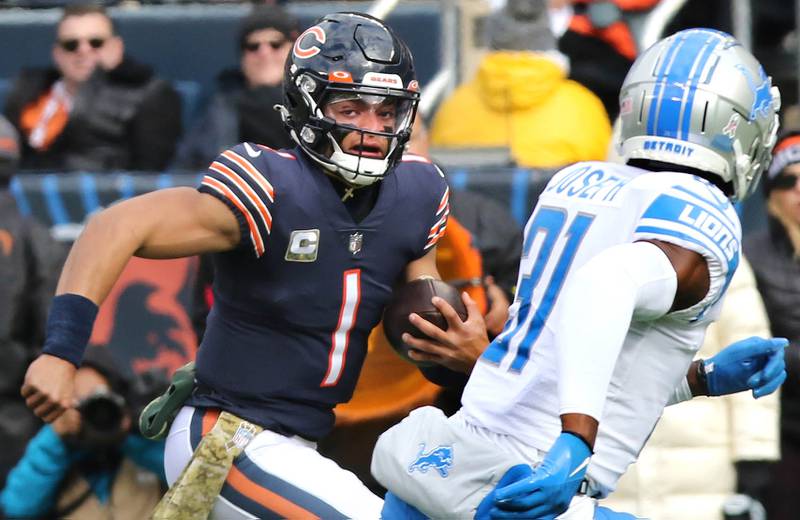Chicago Bears quarterback Justin Fields looks to get by Detroit Lions safety Kerby Joseph during their game Sunday, Nov. 13, 2022, at Soldier Field in Chicago.