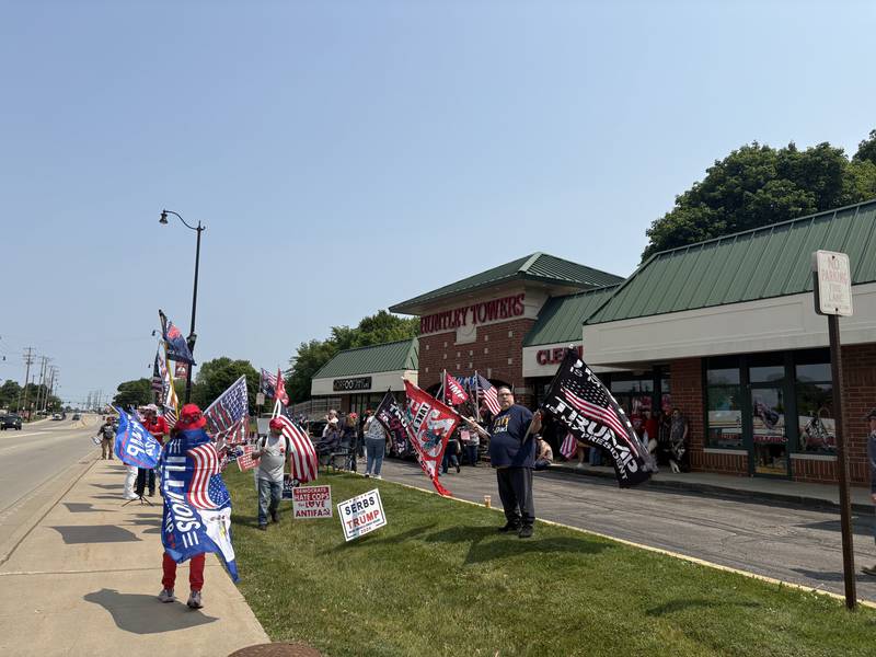 People rally in front of the Trump and Truth Store in Huntley May 31, 2025.