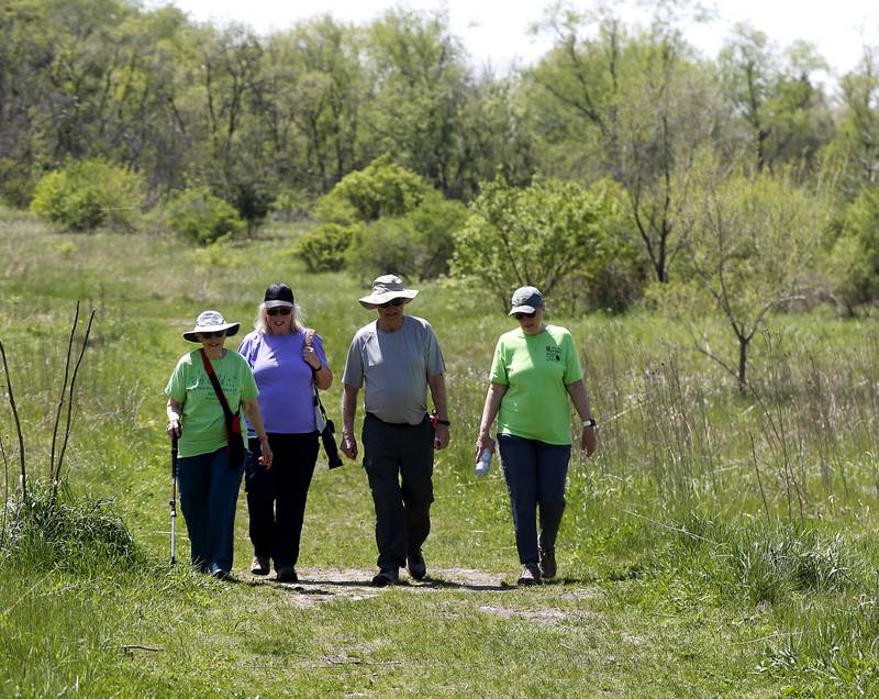 Valerie Koehn, Val Oldenburg, John Scheider and Donna Quinlan hike Wednesday, May 10, 2023, at the Boone Creek Conservation Area in Bull Valley.