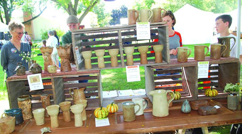 Nancy Ocken, Polo, displayed her stoneware pottery during the 67th Grand Detour Arts Festival at the John Deere Historic Site on Sunday. Photo by Earleen Hinton