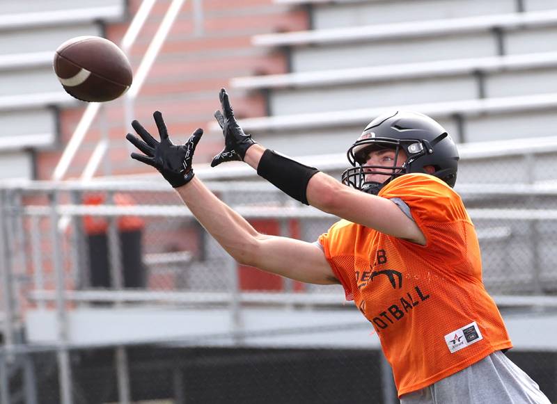 DeKalb’s Lukas Stubblefield catches a pass Wednesday, July 15, 2025, during a summer practice session at the school.