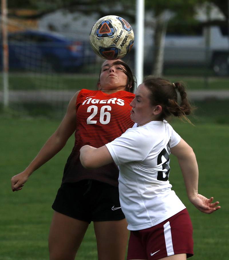 Crystal Lake Central's Olivia Madalinski tries to head the ball away from Prairie Ridge's Karstan Koelblinger during a Fox Valley Conference soccer match Tuesday, May 10, 2022, between Crystal Lake Central and Prairie Ridge at Crystal Lake Central High School.