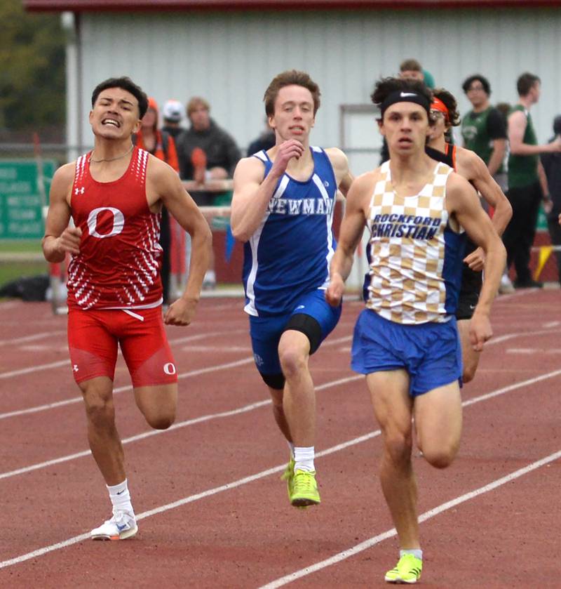 Oregon's Daniel Gonzalez (left) and Sterling Newman's Wyatt Widolff (center) chase Rockford Christian's Evan White to the finish line in the 800 meters at the Hawk Classic on Friday, May 2, 2025 at Landers-Loomis Field in Oregon. White won the race, Widolff was second and Gonzalez third.
