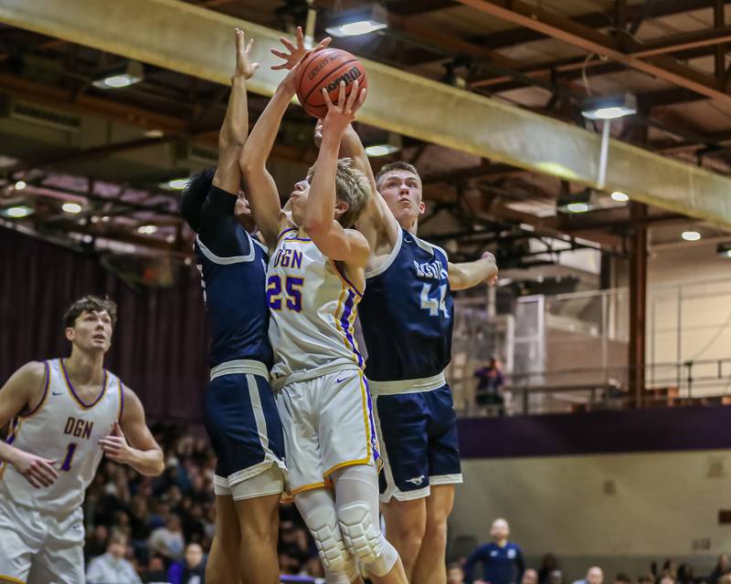 Downers Grove North's Alex Miller (25) attempts a lay up during basketball game between Downers Grove South at Downers Grove North. Dec 16, 2023.