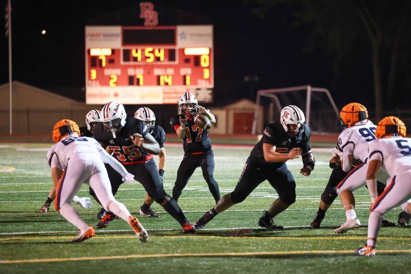 Bradley-Bourbonnais quarterback Ellis Johnson receives the snap as offensive linemen Joel Morrical, right, and Tyrell Berry protect him during the Boilermakers' victory over Stagg on Friday, Sept. 26, 2025.