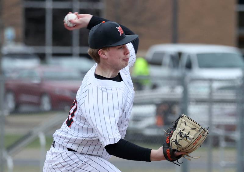DeKalb's Aidan Lange delivers a pitch during their game against Harlem Tuesday, April 1, 2025, at DeKalb High School.