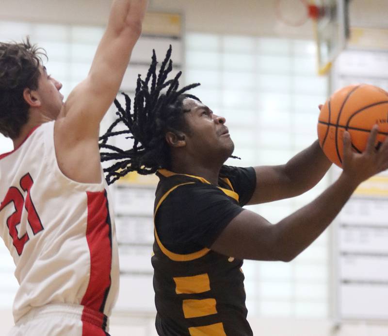Jacobs’ Emaan Thomas soars to the hoop against Barrington during Hinkle Holiday Classic varsity boys basketball tournament action on Monday, Dec. 23, 2024 at Jacobs High School in Algonquin.