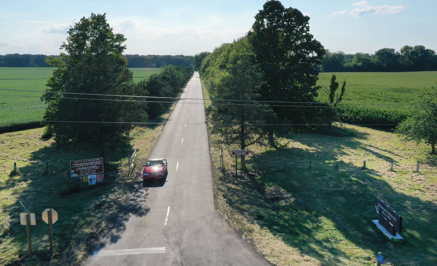 A vehicle drives on the new entrance road to Matthiessen State Park on Tuesday, Aug. 16, 2022 in Oglesby. Crews paved the parking lot and entrance road to Illinois Route 178. A sidewalk was also added along the entrance road.