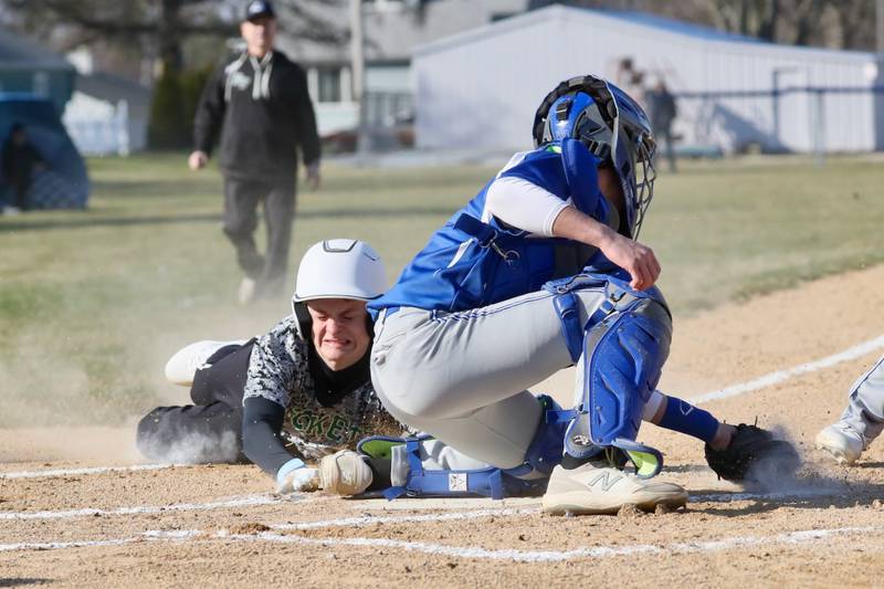 Rock Falls' Owen Mandrell slides in under the tag of Princeton catcher Ace Christiansen to score a first-inning run Thursday at Prather Field. The host Tigers won 5-4.