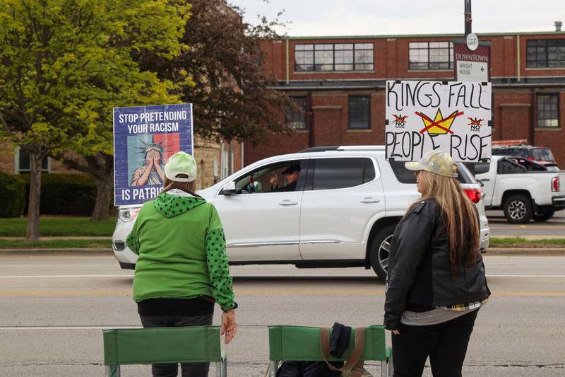 A passerby honks and waves as protesters gather during the May Day Strong rally at the Kankakee County Courthouse on May 1, 2026, as part of a national day of action.