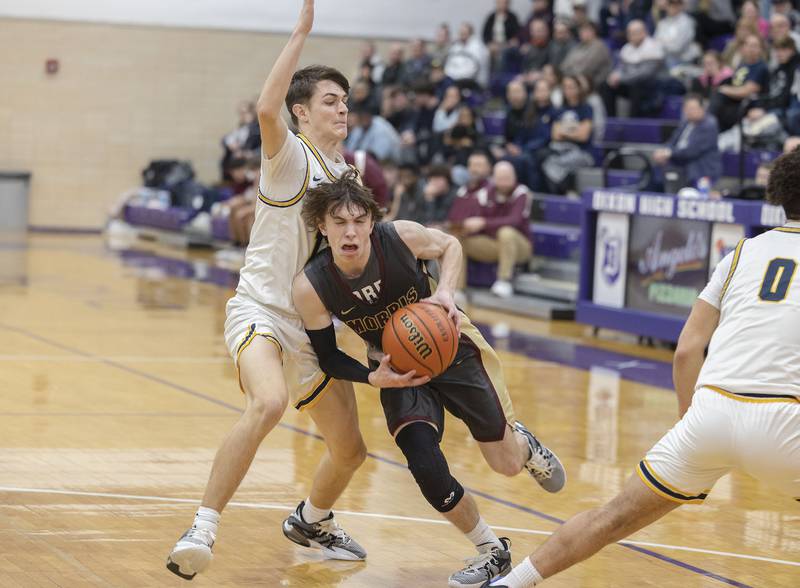 Morris’ Caston Norris drives the the hoop against Sterling Wednesday, Feb. 22, 2023 in the 3A sectional semifinal game.