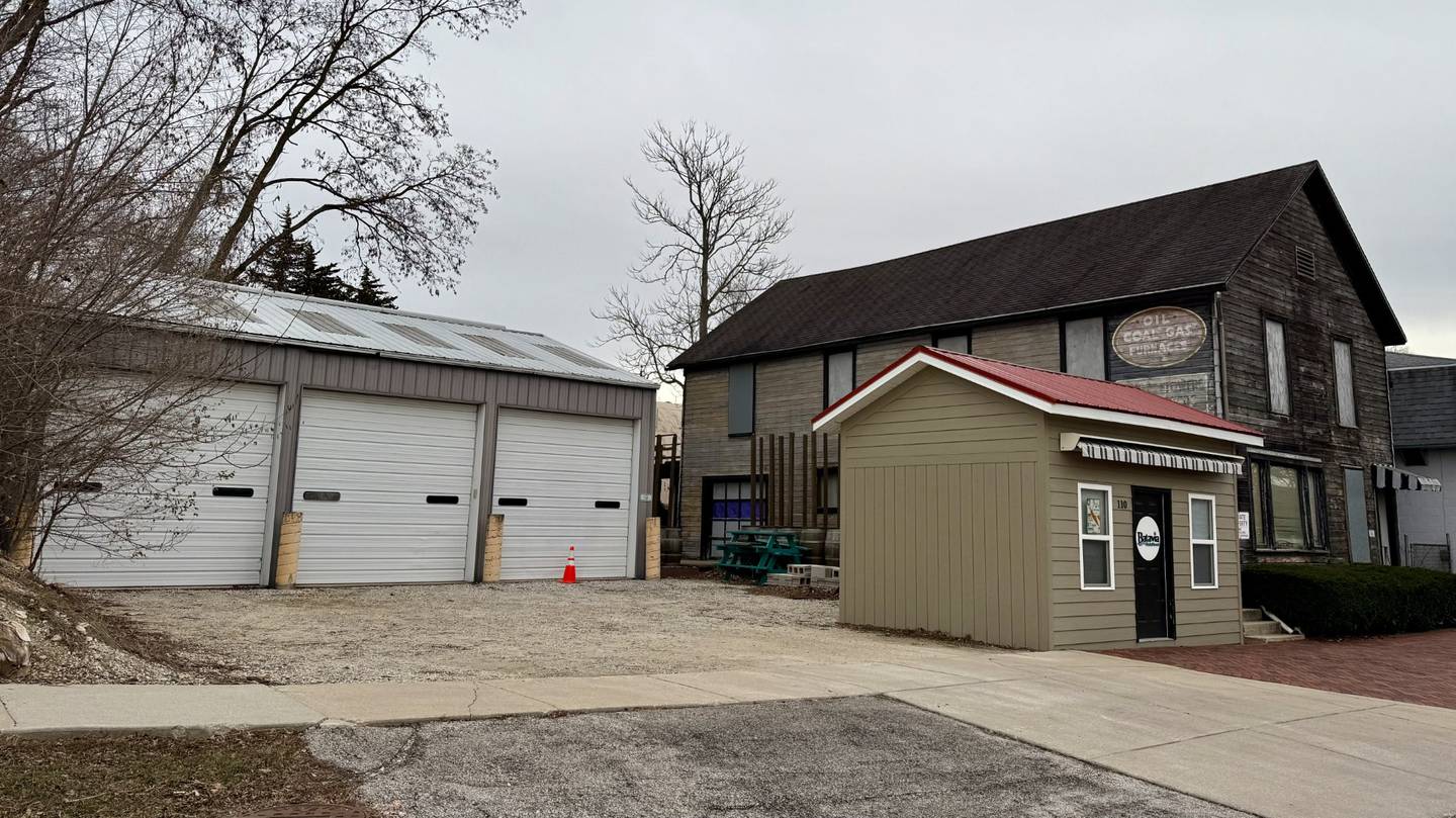 The City of Batavia is planning to demolish the Tin Shop building (right) at 106 N River St. and the adjacent parking garage (left) at 112 N River St. downtown.