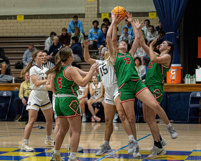 Maragret Boudreau (15) of LaSalle-Peru braces for impact whilst fighting over rebound with Senya Mitre (15) of Marquette on Saturday, January 3, 2026 at Marquette Academy in Ottawa.