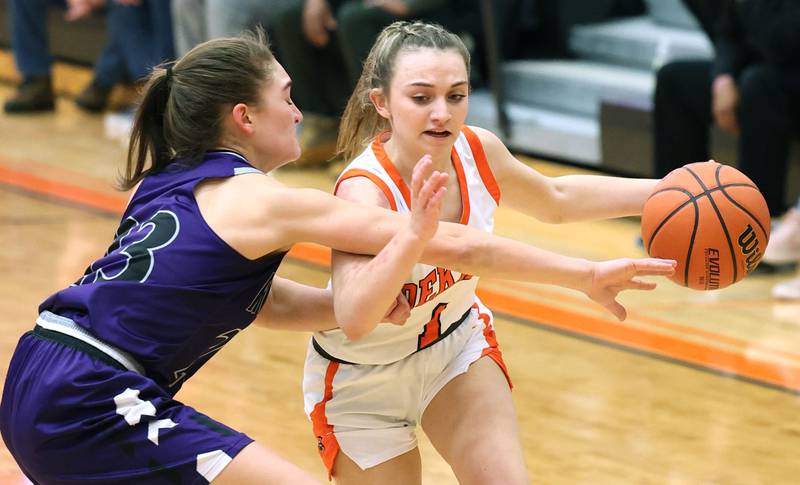 DeKalb's Ella Russell fights through Rochelle's Alivia Henkel during their game Monday, Nov. 28, 2022, at DeKalb High School.