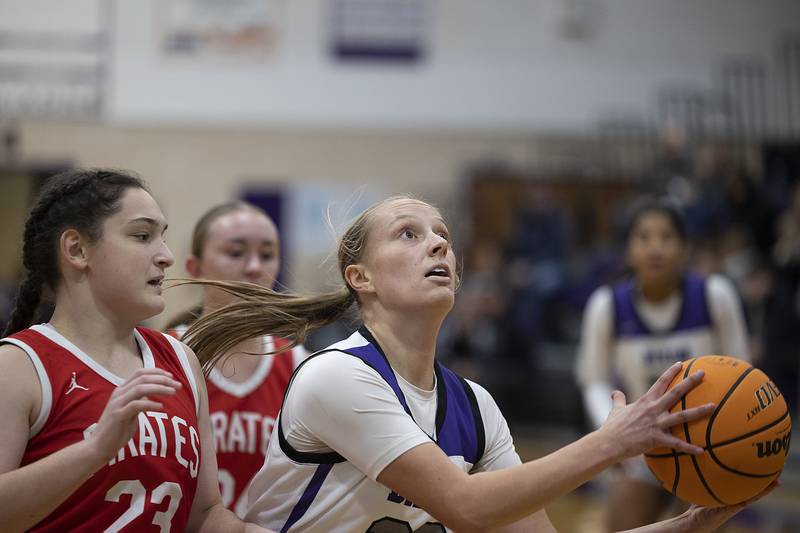 Dixon’s Makenzie Toms looks to put up a shot against  Ottawa Wednesday, Dec. 4, 2024, at Dixon High School.