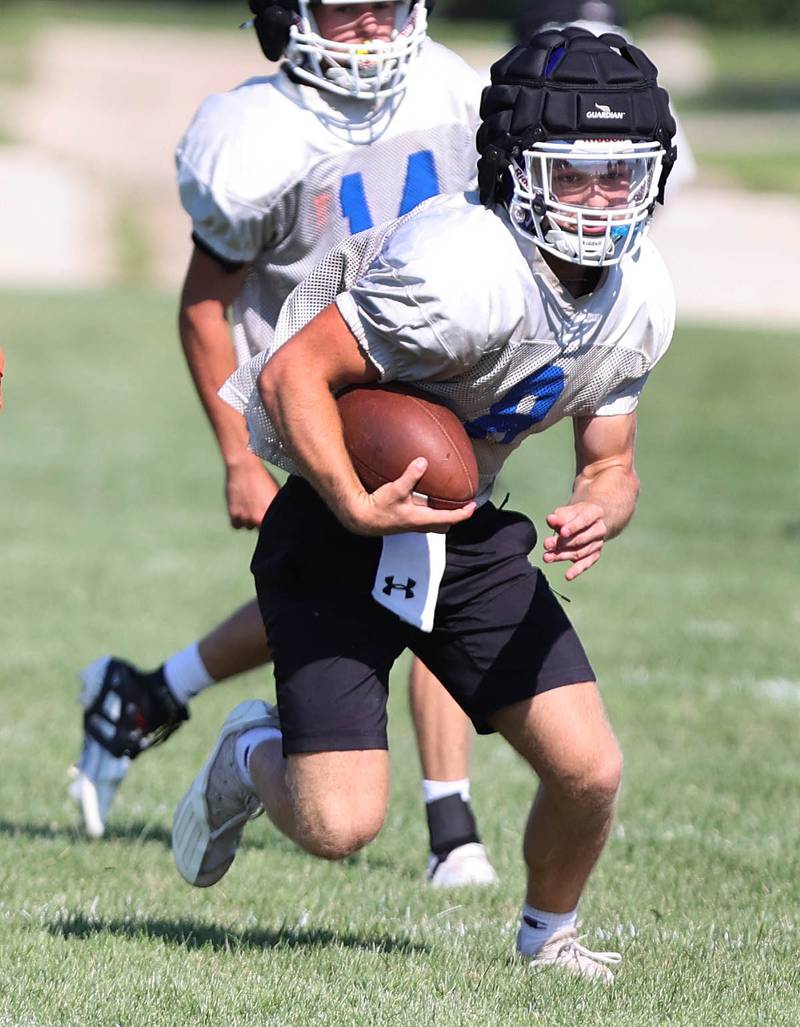Genoa-Kingston's Nolan Perry carries the ball Wednesday, Aug.10, 2022, during practice at the school in Genoa.