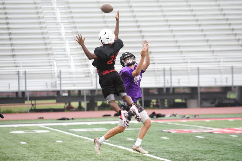 Bradley-Bourbonnais' Byron Sumerall, left, deflects a pass intended for Wilmington's Evan Kuypers during a joint summer workout at Bradley-Bourbonnais Wednesday, July 16, 2025.