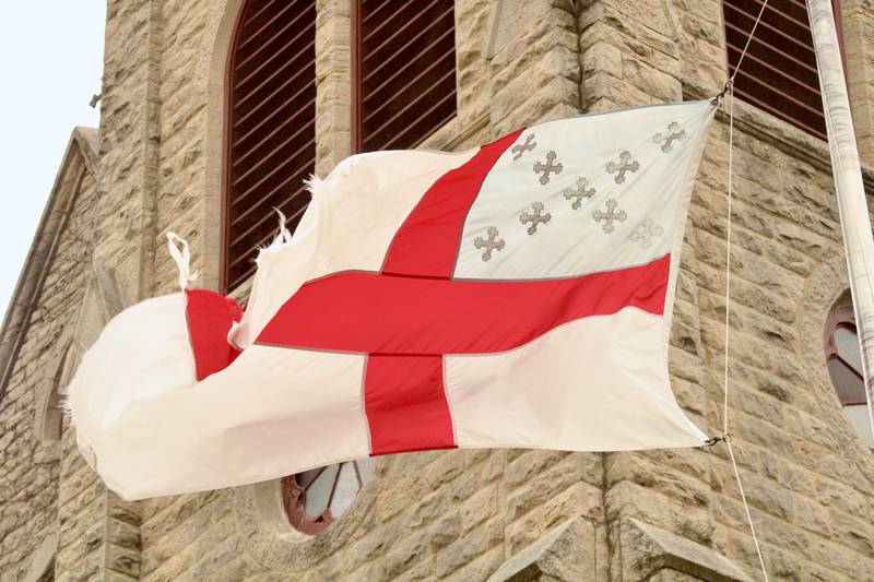Shifting winds whip a denominational flag with the St. George's cross in front of St. Luke's Episcopal Church main tower on Friday afternoon March 31, 2023, in Dixon. The area was under a tornado watch for most of the afternoon.