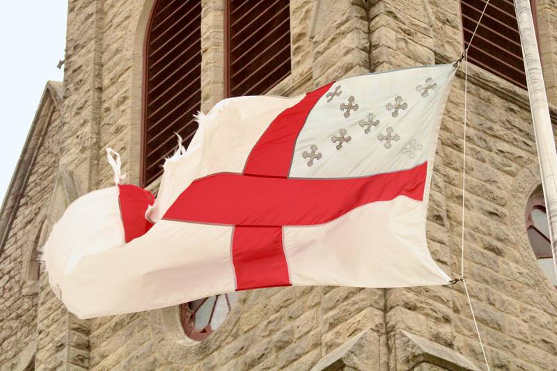 Shifting winds whip a denominational flag with the St. George's cross in front of St. Luke's Episcopal Church main tower on Friday afternoon March 31, 2023, in Dixon. The area was under a tornado watch for most of the afternoon.