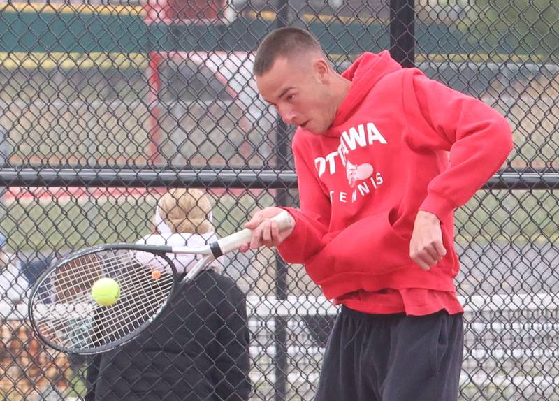 Ottawa's Kaden Araujo returns a serve during the Class 1A Sectional tennis meet on Friday, May 22, 2026 at the La Salle-Peru Township High School Athletic Complex in La Salle.