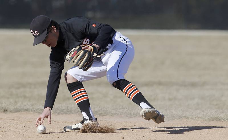 Crystal Lake Central's James Dreher tries to grab the during a nonconference baseball game against BoylanWednesday, March 29, 2023, at Crystal Lake Central High School.