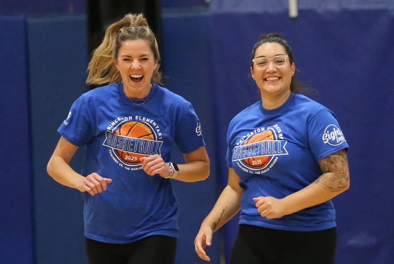 Jefferson School principal Megan Doty and teacher Mia Ochoa react after scoring a point during the Harlem Wizards event on Tuesday, Oct. 28, 2025 in Pannebaker Gymnasium at Logan Jr. High School in Princeton.