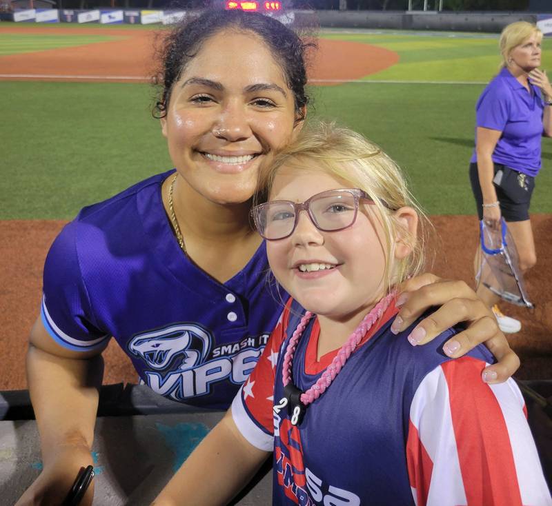 Mya Rosploch, 10, of LaSalle, received a birthday surprise with a meeting of Professional Fastpitch star Jocelyn Alo in Viera, Fla. Monday.