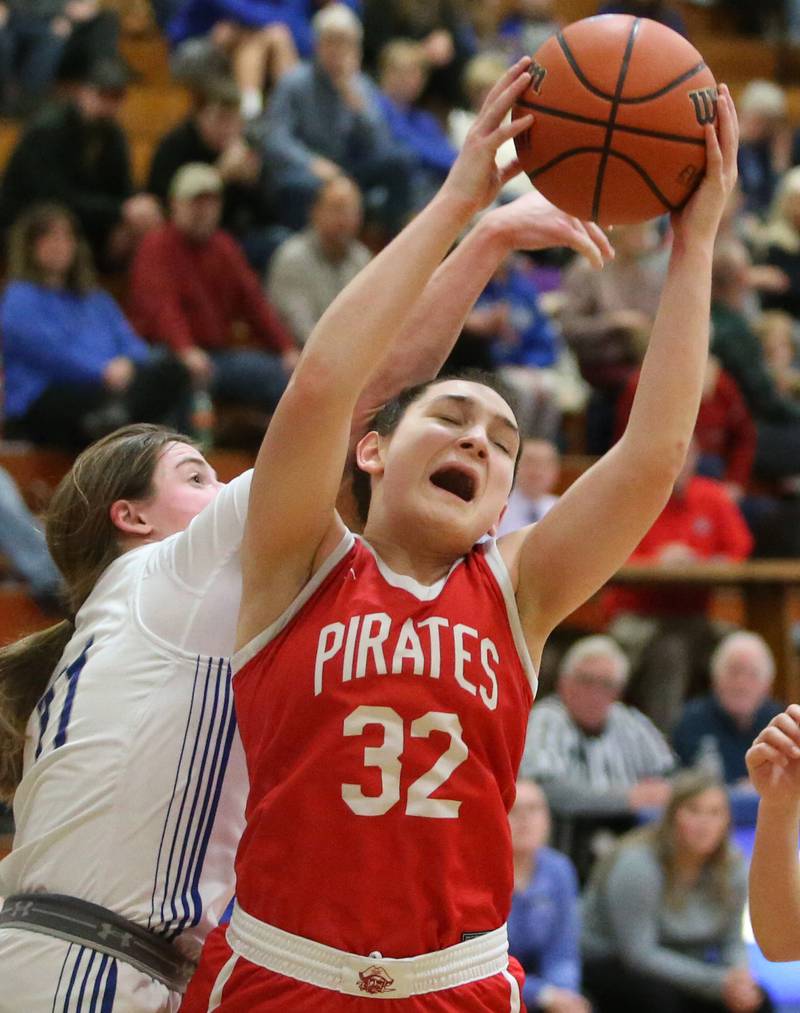 Ottawa's Mary Stisser grabs a rebound over Princeton's Makaya Hecht on Monday, Feb. 5, 2024 in Prouty Gym.