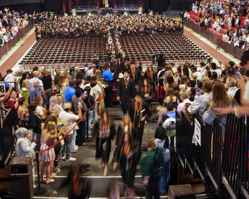 St. Charles East graduates exit the Convocation Center in DeKalb on Monday, May 18, 2026, after the graduation ceremony.