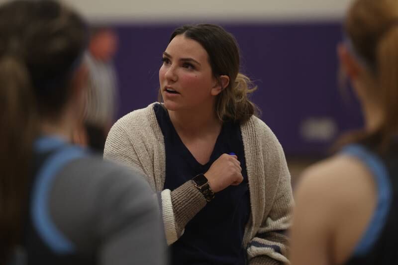 Joliet Catholic head coach Kaitlyn Williams talks to her team during a break against Joliet West in the WJOL Basketball Tournament at Joliet Junior College Event Center on Monday