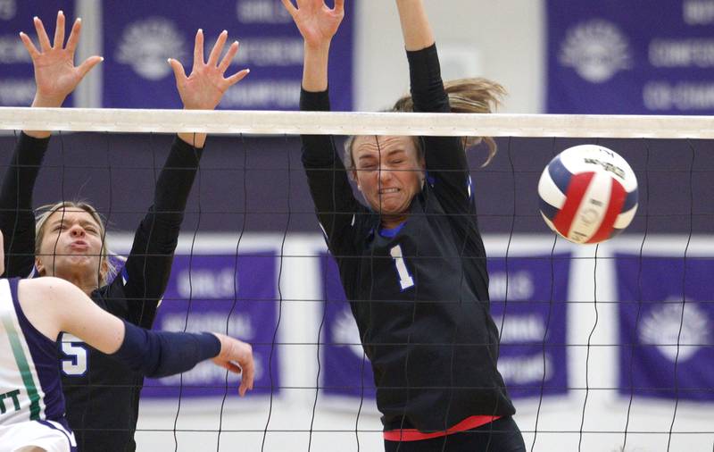 Burlington Central’s Emily Maramba, left, and Peyton Strout block against Bartlett in varsity volleyball tournament action on Saturday, Sept. 21, 2024, at Hampshire High School in Hampshire.