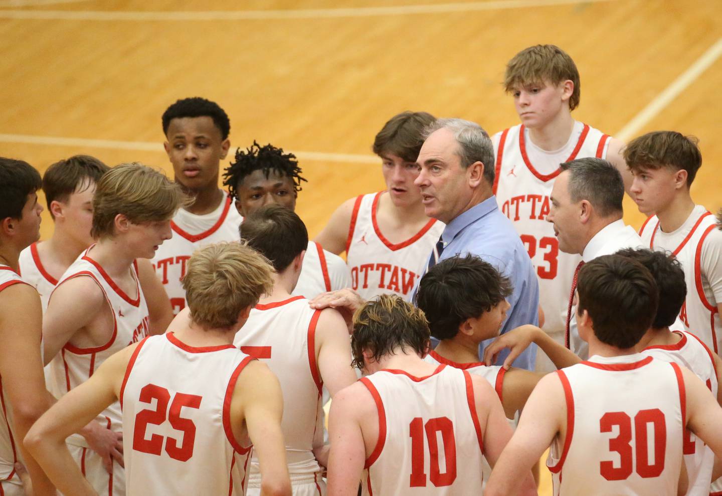 Ottawa head boys basketball coach Mark Cooper coaches his team during the Dean Riley Shootin' The Rock Thanksgiving Tournament on Monday, Nov. 20, 2023 at Kingman Gym.