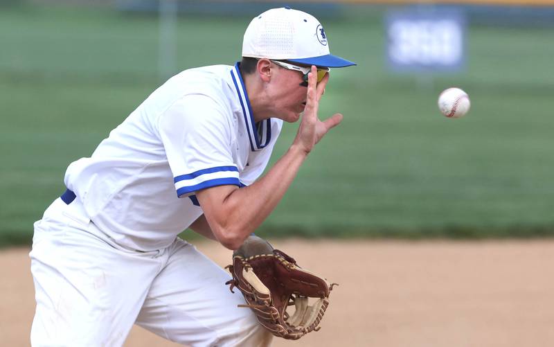 Hinckley-Big Rock's Ben Hintzsche tries to barehand the ball after it takes a bad hop Monday, May 16, 2022, at Hinckley-Big Rock High School during the play-in game against Indian Creek to decide who will advance to participate in the Class 1A Somonauk Regional.