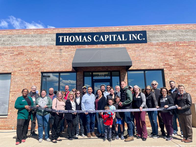 The Sycamore Chamber of Commerce welcoming Thomas Capital, Inc. with a ribbon-cutting