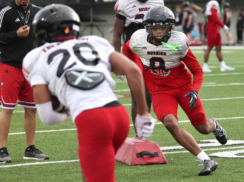 Northern Illinois University cornerback Dev'ion Reynolds looks to make a tackle Tuesday, April 14, 2026, during a drill at spring practice in Huskie Stadium at NIU in DeKalb.