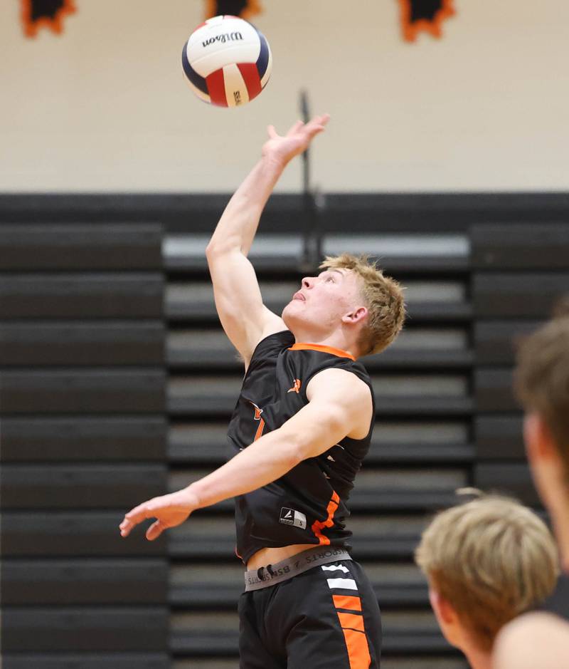 DeKalb’s Grady Fowler spikes the ball Tuesday, April 21, 2026 during their match against Naperville North JV at DeKalb High School.