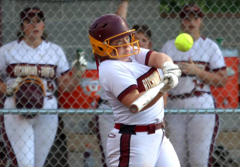 Richmond-Burton’s Lyndsay Regnier belts a three-run triple against Stillman Valley in softball sectional title game action in Richmond Friday evening.