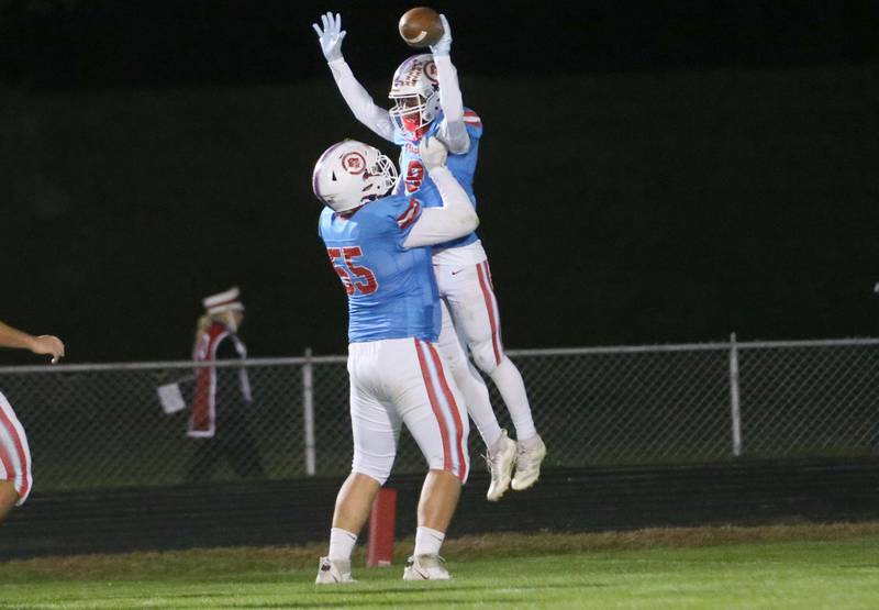 Ottawa's Evan Paris holds up teammate Bryson Valdez after scoring a touchdown against Granite City on Friday, Oct. 24, 2025 on Kingman Field at Ottawa High School.