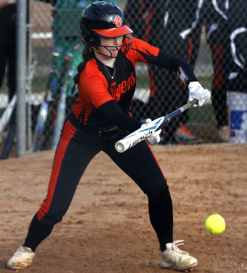 Crystal Lake Central's Makayla Malone bunts the ball during a nonconference softball game  against Marian Central on Thursday, April 3, 2025, at bates Park in Woodstock.